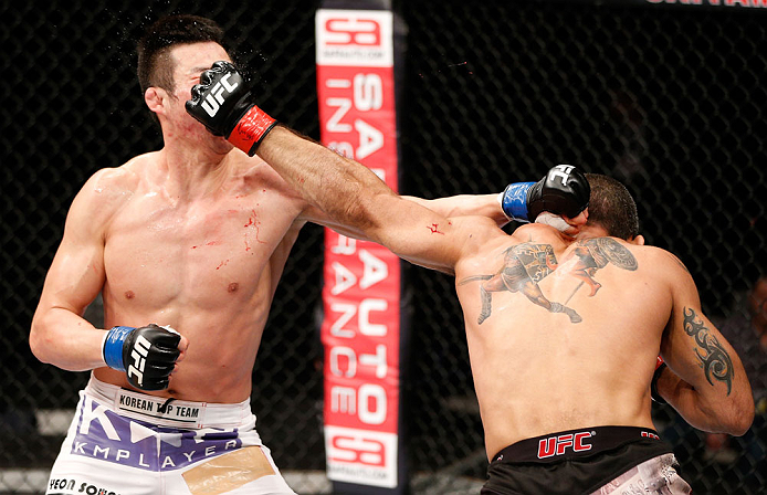 SAITAMA, JAPAN - MARCH 03:  (R-L) Marcelo Guimaraes and Hyun Gyu Lim trade punches in their welterweight fight during the UFC on FUEL TV event at Saitama Super Arena on March 3, 2013 in Saitama, Japan.  (Photo by Josh Hedges/Zuffa LLC/Zuffa LLC via Getty Images)