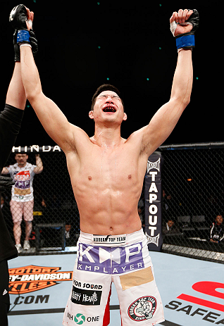 SAITAMA, JAPAN - MARCH 03:  Hyun Gyu Lim reacts after knocking out Marcelo Guimaraes in their welterweight fight during the UFC on FUEL TV event at Saitama Super Arena on March 3, 2013 in Saitama, Japan.  (Photo by Josh Hedges/Zuffa LLC/Zuffa LLC via Getty Images)