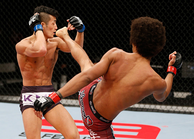 SAITAMA, JAPAN - MARCH 03:  (R-L) Alex Caceres kicks Kyung Ho Kang in their bantamweight fight during the UFC on FUEL TV event at Saitama Super Arena on March 3, 2013 in Saitama, Japan.  (Photo by Josh Hedges/Zuffa LLC/Zuffa LLC via Getty Images)