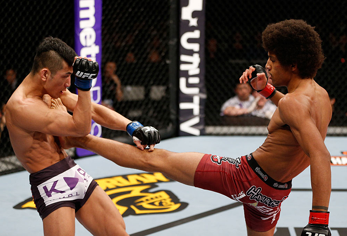 SAITAMA, JAPAN - MARCH 03:  (R-L) Alex Caceres kicks Kyung Ho Kang in their bantamweight fight during the UFC on FUEL TV event at Saitama Super Arena on March 3, 2013 in Saitama, Japan.  (Photo by Josh Hedges/Zuffa LLC/Zuffa LLC via Getty Images)