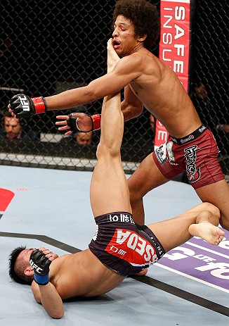 SAITAMA, JAPAN - MARCH 03:  (L-R) Kyung Ho Kang kicks Alex Caceres in their bantamweight fight during the UFC on FUEL TV event at Saitama Super Arena on March 3, 2013 in Saitama, Japan.  (Photo by Josh Hedges/Zuffa LLC/Zuffa LLC via Getty Images)