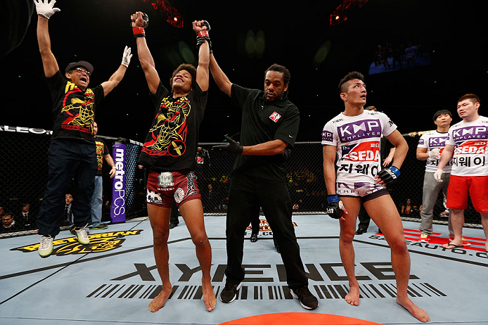 SAITAMA, JAPAN - MARCH 03:  Alex Caceres (L) reacts after defeating Kyung Ho Kang in their bantamweight fight during the UFC on FUEL TV event at Saitama Super Arena on March 3, 2013 in Saitama, Japan.  (Photo by Josh Hedges/Zuffa LLC/Zuffa LLC via Getty Images)