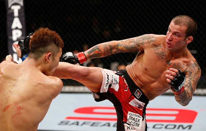 SAITAMA, JAPAN - MARCH 03:  (R-L) Cristiano Marcello kicks Kazuki Tokudome in their lightweight fight during the UFC on FUEL TV event at Saitama Super Arena on March 3, 2013 in Saitama, Japan.  (Photo by Josh Hedges/Zuffa LLC/Zuffa LLC via Getty Images)