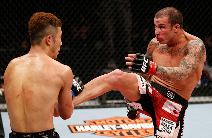 SAITAMA, JAPAN - MARCH 03:  (R-L) Cristiano Marcello kicks Kazuki Tokudome in their lightweight fight during the UFC on FUEL TV event at Saitama Super Arena on March 3, 2013 in Saitama, Japan.  (Photo by Josh Hedges/Zuffa LLC/Zuffa LLC via Getty Images)