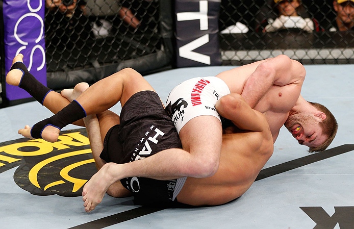 SAITAMA, JAPAN - MARCH 03:  Bryan Caraway (top) attempts to submit Takeya Mizugaki with a guillotine choke in their bantamweight fight during the UFC on FUEL TV event at Saitama Super Arena on March 3, 2013 in Saitama, Japan.  (Photo by Josh Hedges/Zuffa LLC/Zuffa LLC via Getty Images)