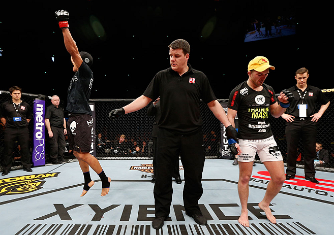 SAITAMA, JAPAN - MARCH 03:  Takeya Mizugaki (L) reacts after defeating Bryan Caraway in their bantamweight fight during the UFC on FUEL TV event at Saitama Super Arena on March 3, 2013 in Saitama, Japan.  (Photo by Josh Hedges/Zuffa LLC/Zuffa LLC via Getty Images)