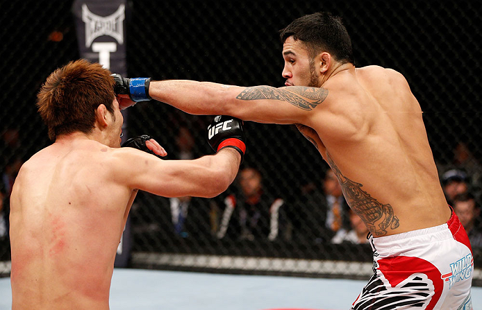 SAITAMA, JAPAN - MARCH 03:  (R-L) Brad Tavares punches Riki Fukuda in their middleweight fight during the UFC on FUEL TV event at Saitama Super Arena on March 3, 2013 in Saitama, Japan.  (Photo by Josh Hedges/Zuffa LLC/Zuffa LLC via Getty Images)