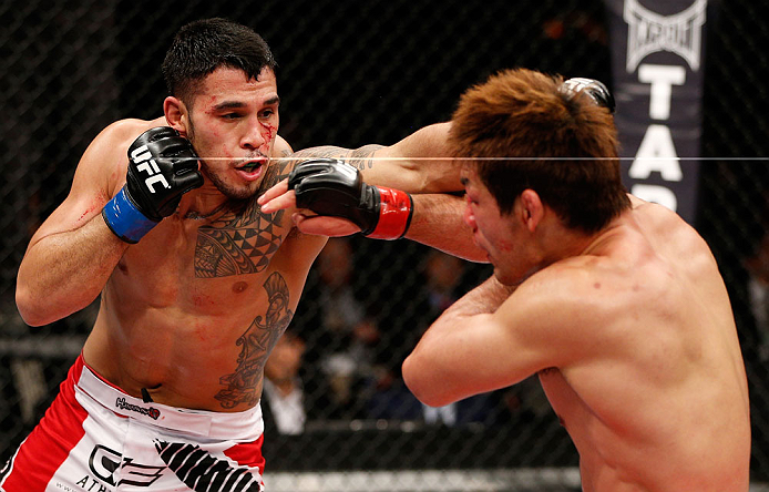 SAITAMA, JAPAN - MARCH 03:  (L-R) Brad Tavares punches Riki Fukuda in their middleweight fight during the UFC on FUEL TV event at Saitama Super Arena on March 3, 2013 in Saitama, Japan.  (Photo by Josh Hedges/Zuffa LLC/Zuffa LLC via Getty Images)