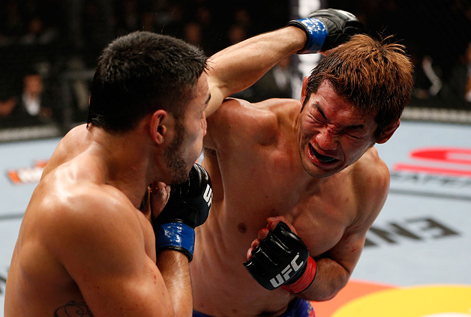 SAITAMA, JAPAN - MARCH 03:  (R-L) Riki Fukuda punches Brad Tavares in their middleweight fight during the UFC on FUEL TV event at Saitama Super Arena on March 3, 2013 in Saitama, Japan.  (Photo by Josh Hedges/Zuffa LLC/Zuffa LLC via Getty Images)