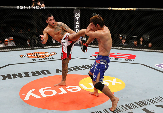 SAITAMA, JAPAN - MARCH 03:  (L-R) Brad Tavares kicks Riki Fukuda in their middleweight fight during the UFC on FUEL TV event at Saitama Super Arena on March 3, 2013 in Saitama, Japan.  (Photo by Josh Hedges/Zuffa LLC/Zuffa LLC via Getty Images)