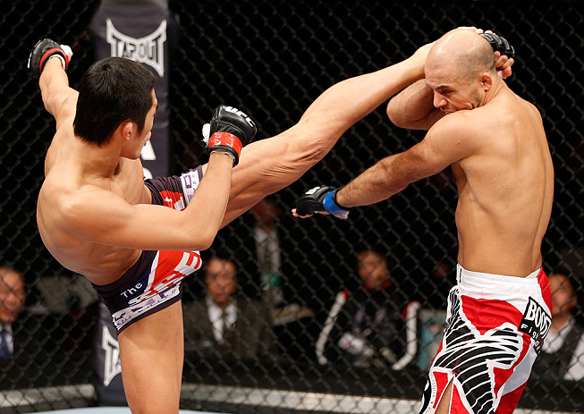 SAITAMA, JAPAN - MARCH 03:  (L-R) Dong Hyun Kim kicks Siyar Bahadurzada in their welterweight fight during the UFC on FUEL TV event at Saitama Super Arena on March 3, 2013 in Saitama, Japan.  (Photo by Josh Hedges/Zuffa LLC/Zuffa LLC via Getty Images)