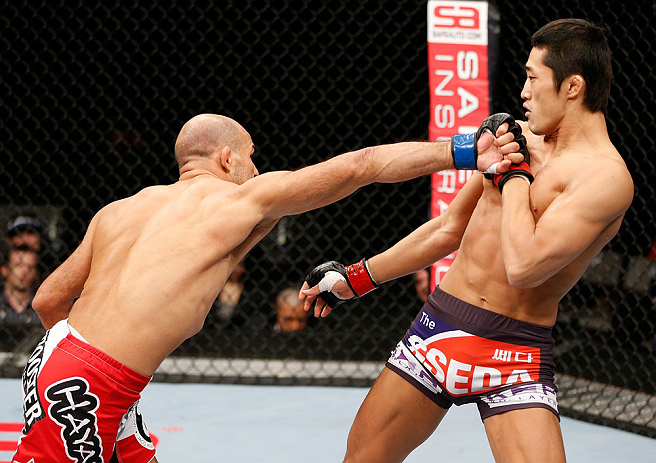 SAITAMA, JAPAN - MARCH 03:  (L-R) Siyar Bahadurzada punches Dong Hyun Kim in their welterweight fight during the UFC on FUEL TV event at Saitama Super Arena on March 3, 2013 in Saitama, Japan.  (Photo by Josh Hedges/Zuffa LLC/Zuffa LLC via Getty Images)