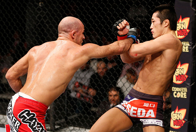 SAITAMA, JAPAN - MARCH 03:  (L-R) Siyar Bahadurzada punches Dong Hyun Kim in their welterweight fight during the UFC on FUEL TV event at Saitama Super Arena on March 3, 2013 in Saitama, Japan.  (Photo by Josh Hedges/Zuffa LLC/Zuffa LLC via Getty Images)