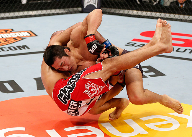 SAITAMA, JAPAN - MARCH 03:  (R-L) Dong Hyun Kim takes down Siyar Bahadurzada in their welterweight fight during the UFC on FUEL TV event at Saitama Super Arena on March 3, 2013 in Saitama, Japan.  (Photo by Josh Hedges/Zuffa LLC/Zuffa LLC via Getty Images)
