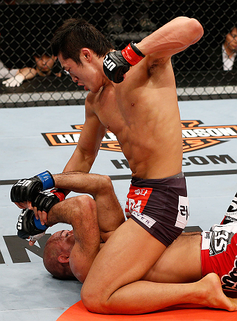 SAITAMA, JAPAN - MARCH 03:  (R-L) Dong Hyun Kim punches Siyar Bahadurzada in their welterweight fight during the UFC on FUEL TV event at Saitama Super Arena on March 3, 2013 in Saitama, Japan.  (Photo by Josh Hedges/Zuffa LLC/Zuffa LLC via Getty Images)