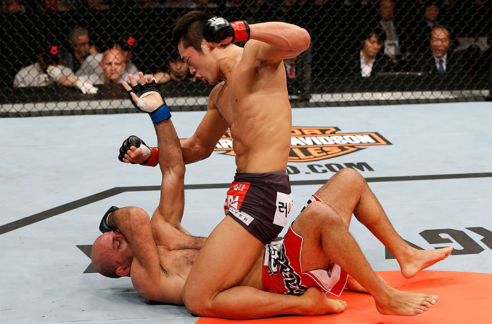 SAITAMA, JAPAN - MARCH 03:  (R-L) Dong Hyun Kim punches Siyar Bahadurzada in their welterweight fight during the UFC on FUEL TV event at Saitama Super Arena on March 3, 2013 in Saitama, Japan.  (Photo by Josh Hedges/Zuffa LLC/Zuffa LLC via Getty Images)