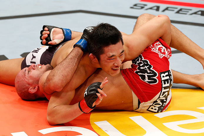 SAITAMA, JAPAN - MARCH 03:  (L-R) Dong Hyun Kim smiles at his corner during his welterweight fight against Siyar Bahadurzada during the UFC on FUEL TV event at Saitama Super Arena on March 3, 2013 in Saitama, Japan.  (Photo by Josh Hedges/Zuffa LLC/Zuffa LLC via Getty Images)