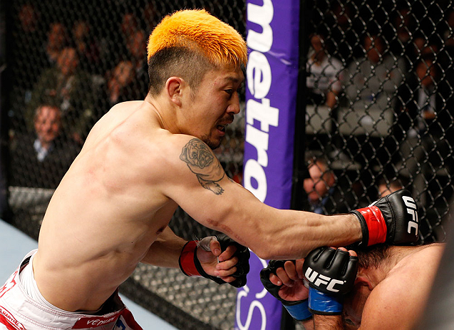 SAITAMA, JAPAN - MARCH 03:  (L-R) Mizuto Hirota punches Rani Yahya in their featherweight fight during the UFC on FUEL TV event at Saitama Super Arena on March 3, 2013 in Saitama, Japan.  (Photo by Josh Hedges/Zuffa LLC/Zuffa LLC via Getty Images)