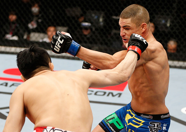 SAITAMA, JAPAN - MARCH 03:  (R-L) Diego Sanchez and Takanori Gomi trade punches in their lightweight fight during the UFC on FUEL TV event at Saitama Super Arena on March 3, 2013 in Saitama, Japan.  (Photo by Josh Hedges/Zuffa LLC/Zuffa LLC via Getty Images)