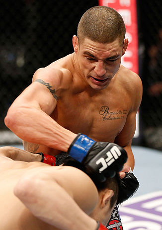 SAITAMA, JAPAN - MARCH 03:  (R-L) Diego Sanchez punches Takanori Gomi in their lightweight fight during the UFC on FUEL TV event at Saitama Super Arena on March 3, 2013 in Saitama, Japan.  (Photo by Josh Hedges/Zuffa LLC/Zuffa LLC via Getty Images)
