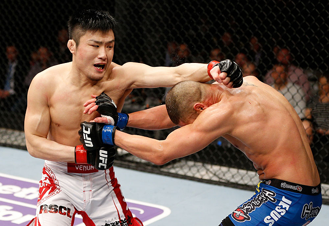 SAITAMA, JAPAN - MARCH 03:  (L-R) Takanori Gomi punches Diego Sanchez in their lightweight fight during the UFC on FUEL TV event at Saitama Super Arena on March 3, 2013 in Saitama, Japan.  (Photo by Josh Hedges/Zuffa LLC/Zuffa LLC via Getty Images)