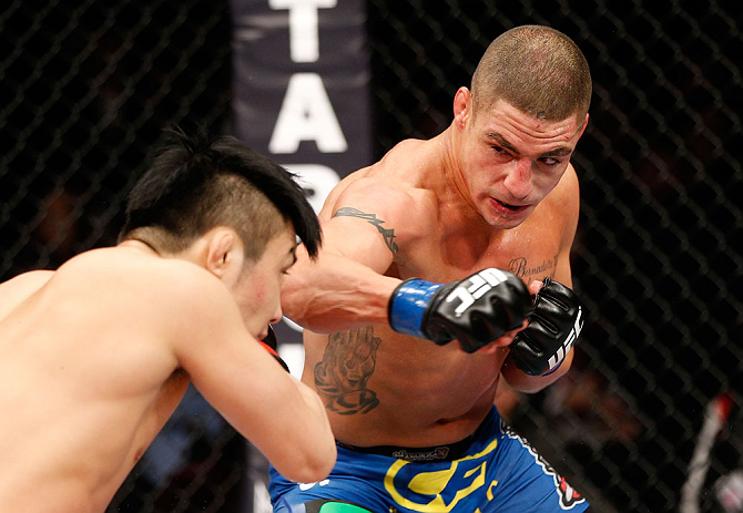 SAITAMA, JAPAN - MARCH 03:  (R-L) Diego Sanchez punches Takanori Gomi in their lightweight fight during the UFC on FUEL TV event at Saitama Super Arena on March 3, 2013 in Saitama, Japan.  (Photo by Josh Hedges/Zuffa LLC/Zuffa LLC via Getty Images)