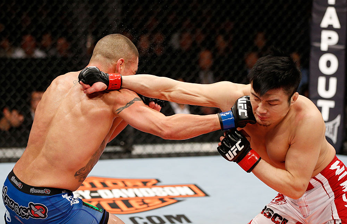 SAITAMA, JAPAN - MARCH 03:  (L-R) Diego Sanchez and Takanori Gomi trade punches in their lightweight fight during the UFC on FUEL TV event at Saitama Super Arena on March 3, 2013 in Saitama, Japan.  (Photo by Josh Hedges/Zuffa LLC/Zuffa LLC via Getty Images)