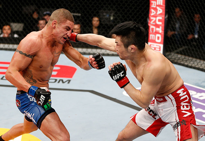 SAITAMA, JAPAN - MARCH 03:  (R-L) Takanori Gomi punches Diego Sanchez in their lightweight fight during the UFC on FUEL TV event at Saitama Super Arena on March 3, 2013 in Saitama, Japan.  (Photo by Josh Hedges/Zuffa LLC/Zuffa LLC via Getty Images)