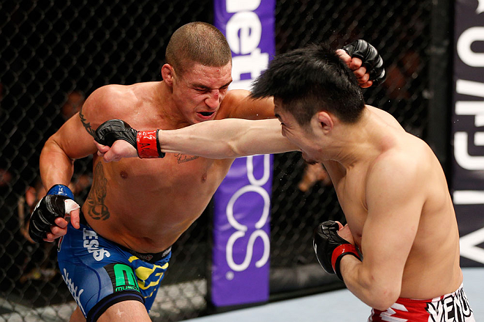 SAITAMA, JAPAN - MARCH 03:  (L-R) Diego Sanchez and Takanori Gomi trade punches in their lightweight fight during the UFC on FUEL TV event at Saitama Super Arena on March 3, 2013 in Saitama, Japan.  (Photo by Josh Hedges/Zuffa LLC/Zuffa LLC via Getty Images)