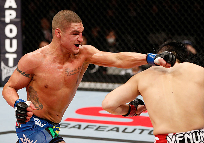 SAITAMA, JAPAN - MARCH 03:  (L-R) Diego Sanchez punches Takanori Gomi in their lightweight fight during the UFC on FUEL TV event at Saitama Super Arena on March 3, 2013 in Saitama, Japan.  (Photo by Josh Hedges/Zuffa LLC/Zuffa LLC via Getty Images)