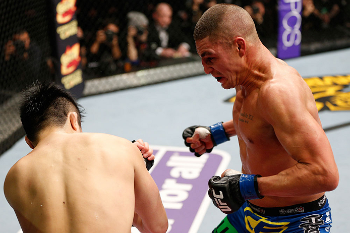 SAITAMA, JAPAN - MARCH 03:  (R-L) Diego Sanchez punches Takanori Gomi in their lightweight fight during the UFC on FUEL TV event at Saitama Super Arena on March 3, 2013 in Saitama, Japan.  (Photo by Josh Hedges/Zuffa LLC/Zuffa LLC via Getty Images)