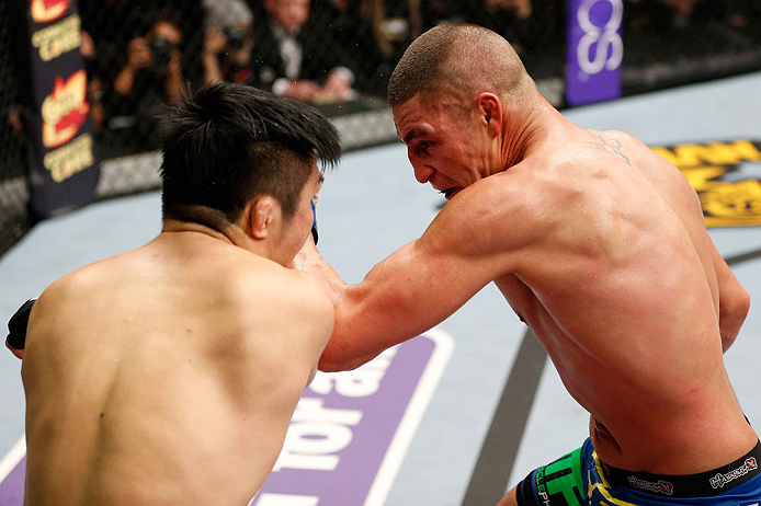 SAITAMA, JAPAN - MARCH 03:  (R-L) Diego Sanchez punches Takanori Gomi in their lightweight fight during the UFC on FUEL TV event at Saitama Super Arena on March 3, 2013 in Saitama, Japan.  (Photo by Josh Hedges/Zuffa LLC/Zuffa LLC via Getty Images)