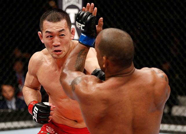 SAITAMA, JAPAN - MARCH 03:  (L-R) Yushin Okami punches Hector Lombard in their middleweight fight during the UFC on FUEL TV event at Saitama Super Arena on March 3, 2013 in Saitama, Japan.  (Photo by Josh Hedges/Zuffa LLC/Zuffa LLC via Getty Images)