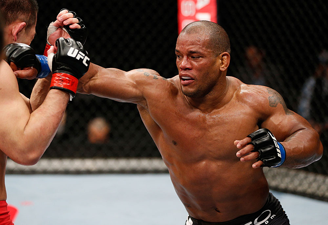 SAITAMA, JAPAN - MARCH 03:  (R-L) Hector Lombard punches Yushin Okami in their middleweight fight during the UFC on FUEL TV event at Saitama Super Arena on March 3, 2013 in Saitama, Japan.  (Photo by Josh Hedges/Zuffa LLC/Zuffa LLC via Getty Images)