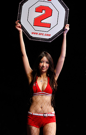 SAITAMA, JAPAN - MARCH 03:  UFC Octagon Girl Azusa Nishigaki introduces a round during the UFC on FUEL TV event at Saitama Super Arena on March 3, 2013 in Saitama, Japan.  (Photo by Josh Hedges/Zuffa LLC/Zuffa LLC via Getty Images)