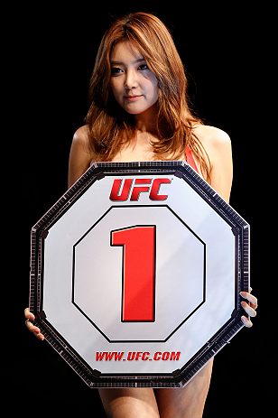 SAITAMA, JAPAN - MARCH 03:  UFC Octagon Girl Su-Jung Lee introduces a round during the UFC on FUEL TV event at Saitama Super Arena on March 3, 2013 in Saitama, Japan.  (Photo by Josh Hedges/Zuffa LLC/Zuffa LLC via Getty Images)