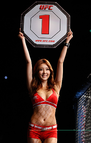SAITAMA, JAPAN - MARCH 03:  UFC Octagon Girl Su-Jung Lee introduces a round during the UFC on FUEL TV event at Saitama Super Arena on March 3, 2013 in Saitama, Japan.  (Photo by Josh Hedges/Zuffa LLC/Zuffa LLC via Getty Images)