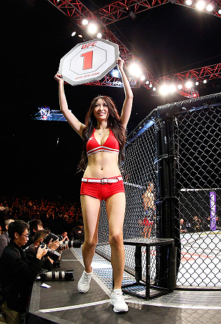SAITAMA, JAPAN - MARCH 03:  UFC Octagon Girl Azusa Nishigaki introduces a round during the UFC on FUEL TV event at Saitama Super Arena on March 3, 2013 in Saitama, Japan.  (Photo by Josh Hedges/Zuffa LLC/Zuffa LLC via Getty Images)