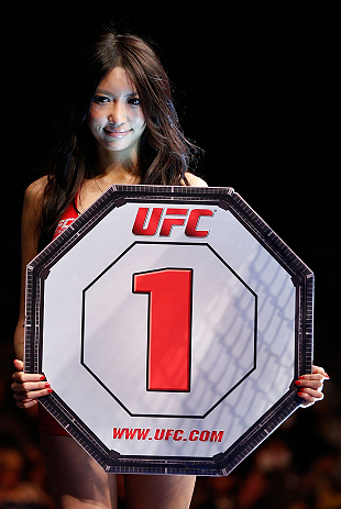 SAITAMA, JAPAN - MARCH 03:  UFC Octagon Girl Azusa Nishigaki introduces a round during the UFC on FUEL TV event at Saitama Super Arena on March 3, 2013 in Saitama, Japan.  (Photo by Josh Hedges/Zuffa LLC/Zuffa LLC via Getty Images)