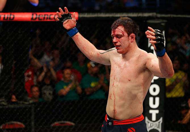 GOLD COAST, AUSTRALIA - DECEMBER 15:  Bradley Scott reacts after the conclusion of his welterweight fight against Robert Whittaker at the UFC on FX event on December 15, 2012  at Gold Coast Convention and Exhibition Centre in Gold Coast, Australia.  (Photo by Josh Hedges/Zuffa LLC/Zuffa LLC via Getty Images)