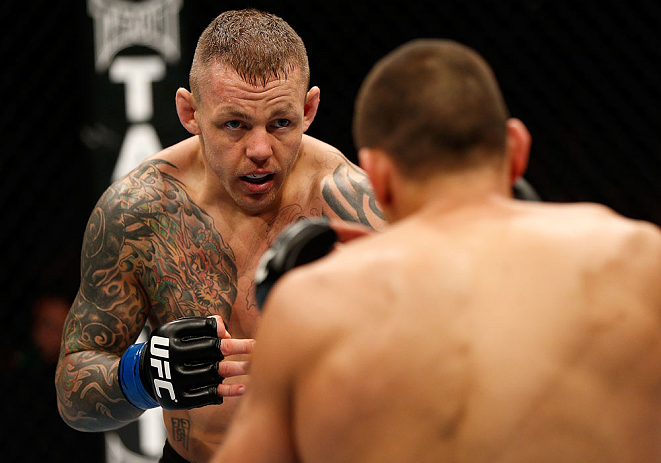 GOLD COAST, AUSTRALIA - DECEMBER 15:  (L-R) Ross Pearson squares off with George Sotiropoulos during their lightweight fight at the UFC on FX event on December 15, 2012  at Gold Coast Convention and Exhibition Centre in Gold Coast, Australia.  (Photo by Josh Hedges/Zuffa LLC/Zuffa LLC via Getty Images)