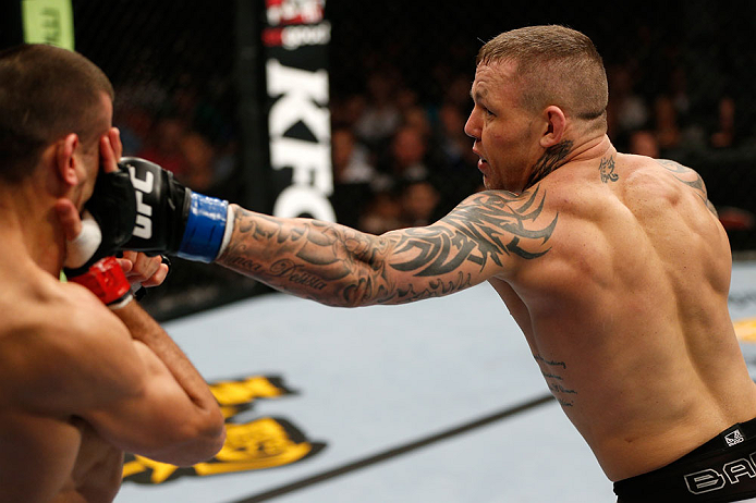 GOLD COAST, AUSTRALIA - DECEMBER 15:  (R-L) Ross Pearson punches George Sotiropoulos during their lightweight fight at the UFC on FX event on December 15, 2012  at Gold Coast Convention and Exhibition Centre in Gold Coast, Australia.  (Photo by Josh Hedges/Zuffa LLC/Zuffa LLC via Getty Images)
