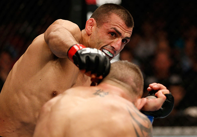 GOLD COAST, AUSTRALIA - DECEMBER 15:  (L-R) George Sotiropoulos punches Ross Pearson during their lightweight fight at the UFC on FX event on December 15, 2012  at Gold Coast Convention and Exhibition Centre in Gold Coast, Australia.  (Photo by Josh Hedges/Zuffa LLC/Zuffa LLC via Getty Images)