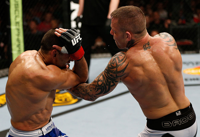 GOLD COAST, AUSTRALIA - DECEMBER 15:  (R-L) Ross Pearson punches George Sotiropoulos during their lightweight fight at the UFC on FX event on December 15, 2012  at Gold Coast Convention and Exhibition Centre in Gold Coast, Australia.  (Photo by Josh Hedges/Zuffa LLC/Zuffa LLC via Getty Images)