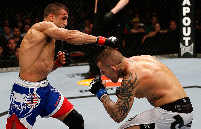 GOLD COAST, AUSTRALIA - DECEMBER 15:  (L-R) George Sotiropoulos punches Ross Pearson during their lightweight fight at the UFC on FX event on December 15, 2012  at Gold Coast Convention and Exhibition Centre in Gold Coast, Australia.  (Photo by Josh Hedges/Zuffa LLC/Zuffa LLC via Getty Images)
