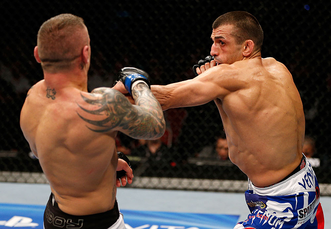 GOLD COAST, AUSTRALIA - DECEMBER 15:  (R-L) George Sotiropoulos punches Ross Pearson during their lightweight fight at the UFC on FX event on December 15, 2012  at Gold Coast Convention and Exhibition Centre in Gold Coast, Australia.  (Photo by Josh Hedges/Zuffa LLC/Zuffa LLC via Getty Images)