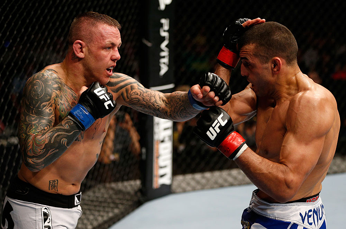 GOLD COAST, AUSTRALIA - DECEMBER 15:  (L-R) Ross Pearson punches George Sotiropoulos during their lightweight fight at the UFC on FX event on December 15, 2012  at Gold Coast Convention and Exhibition Centre in Gold Coast, Australia.  (Photo by Josh Hedges/Zuffa LLC/Zuffa LLC via Getty Images)