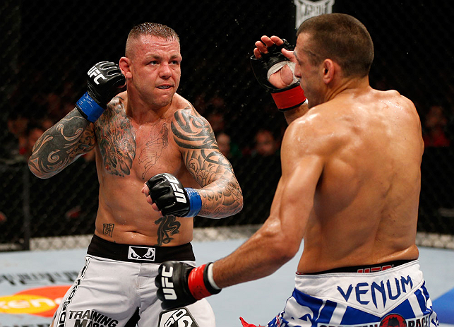 GOLD COAST, AUSTRALIA - DECEMBER 15:  (L-R) Ross Pearson punches George Sotiropoulos during their lightweight fight at the UFC on FX event on December 15, 2012  at Gold Coast Convention and Exhibition Centre in Gold Coast, Australia.  (Photo by Josh Hedges/Zuffa LLC/Zuffa LLC via Getty Images)