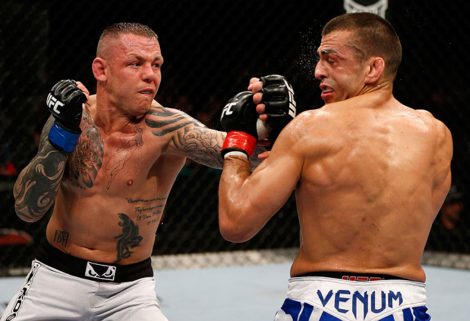 GOLD COAST, AUSTRALIA - DECEMBER 15:  (L-R) Ross Pearson punches George Sotiropoulos during their lightweight fight at the UFC on FX event on December 15, 2012  at Gold Coast Convention and Exhibition Centre in Gold Coast, Australia.  (Photo by Josh Hedges/Zuffa LLC/Zuffa LLC via Getty Images)