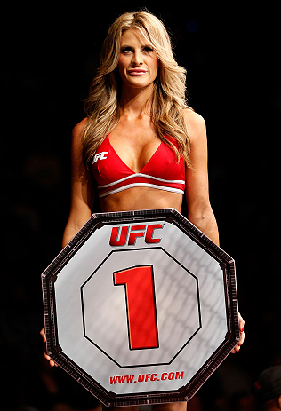 GOLD COAST, AUSTRALIA - DECEMBER 15:  UFC Octagon Girl Kristie McKeon introduces a round during the UFC on FX event on December 15, 2012  at Gold Coast Convention and Exhibition Centre in Gold Coast, Australia.  (Photo by Josh Hedges/Zuffa LLC/Zuffa LLC via Getty Images)